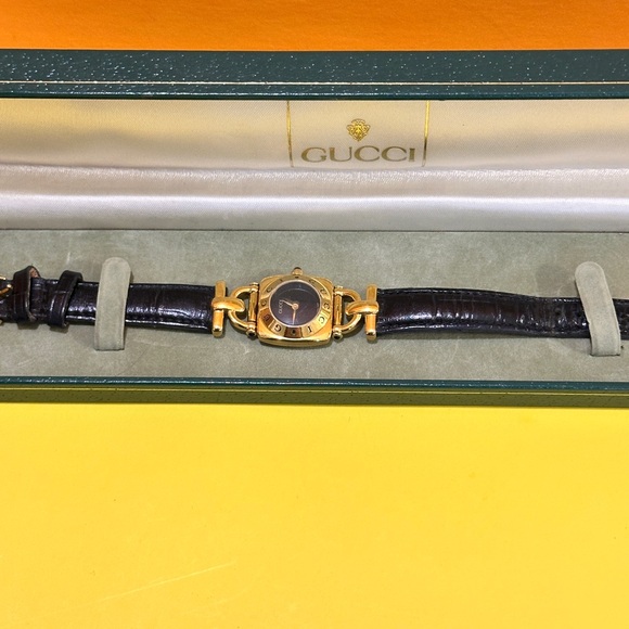 Gucci Accessories - Gucci Gold and Black Women's Watch